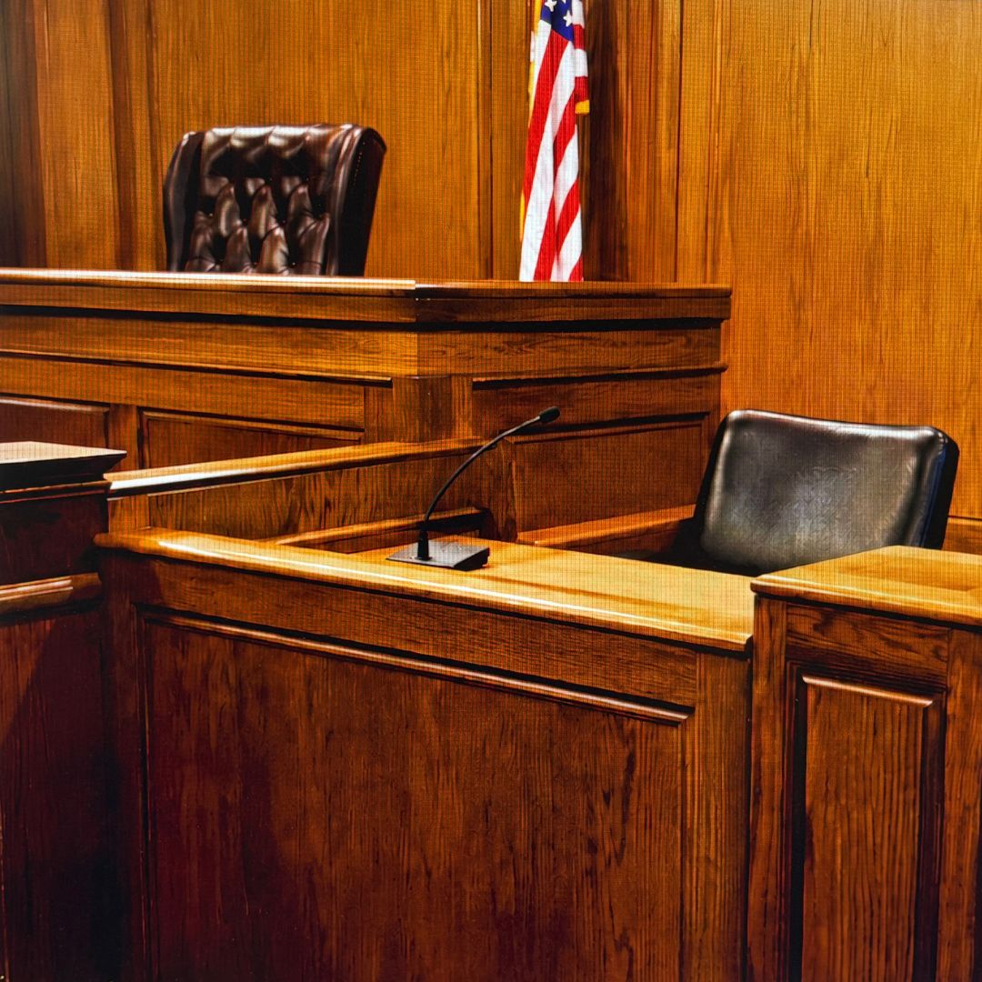 The witness stand in a court room.
